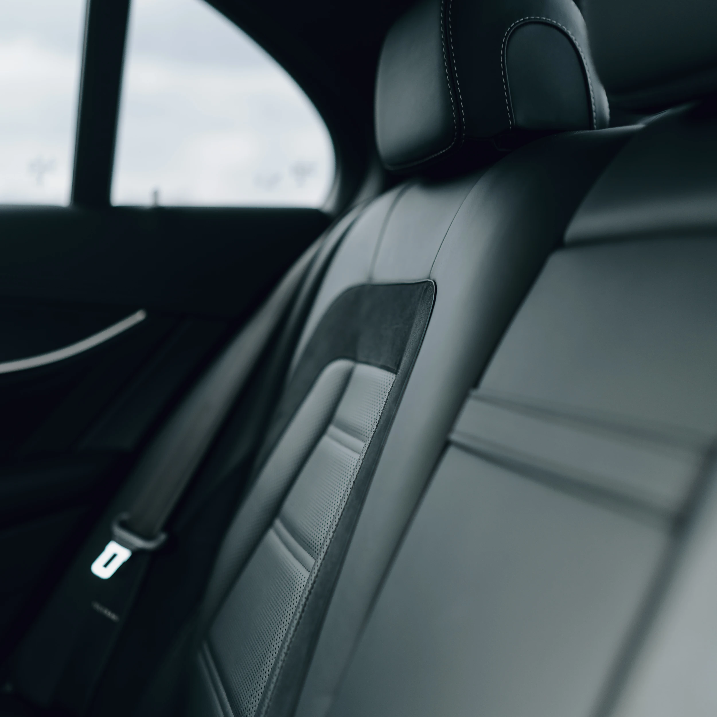 Rear passenger interior of Mercedes-Benz E-Class business class vehicle offering executive comfort