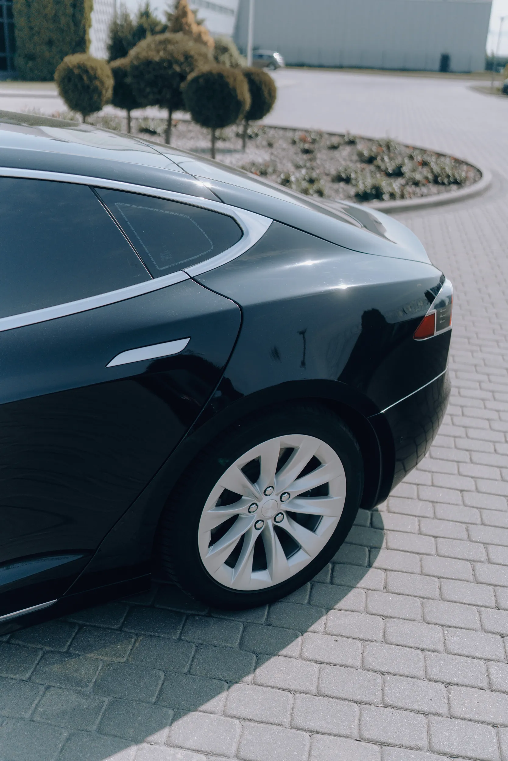 Tesla Model S electric vehicle rear view for silent and comfortable transfers