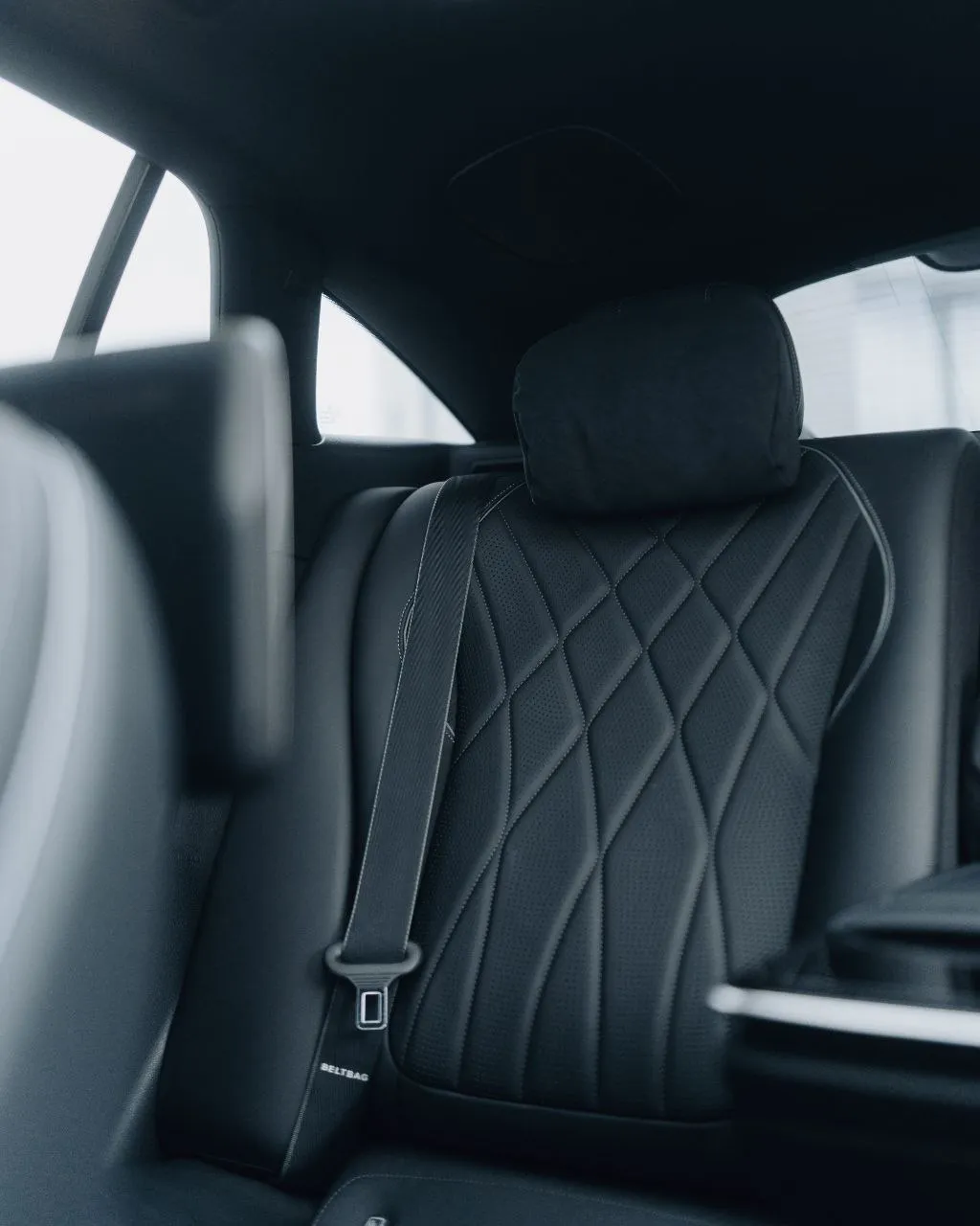 Rear passenger interior of Mercedes-Benz EQS luxury class vehicle with executive comfort